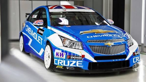 RML Group Chevy Cruze race car in studio garage